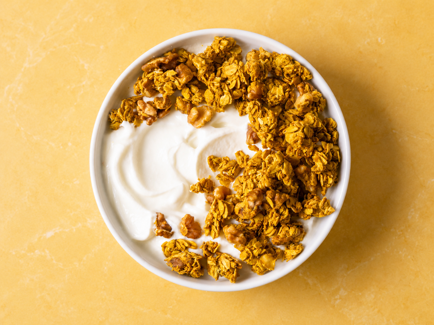 Orange essence walnut granola in a bowl — gluten free, no seed oils