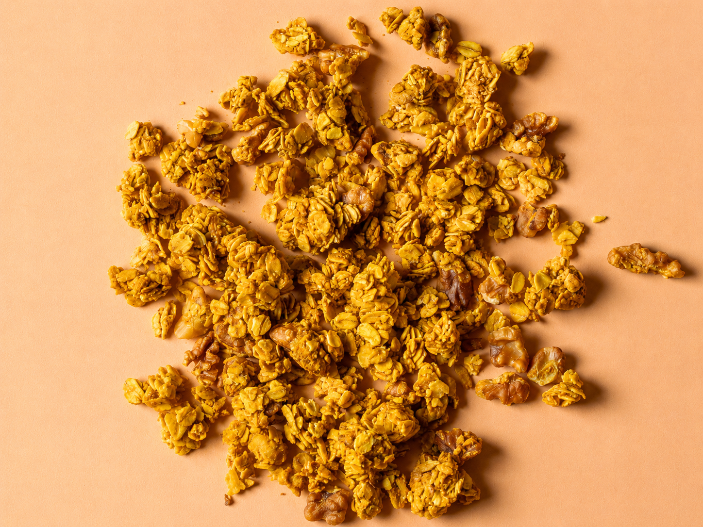 Orange walnut granola clusters with orange zest — organic oats and walnuts