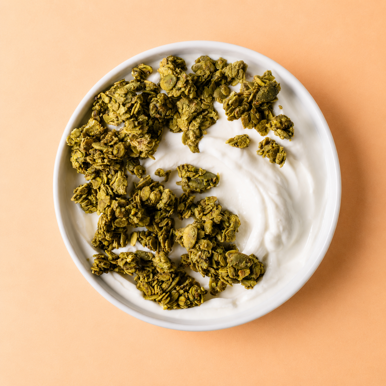 Pistachio matcha granola in a bowl — no seed oils, gluten free